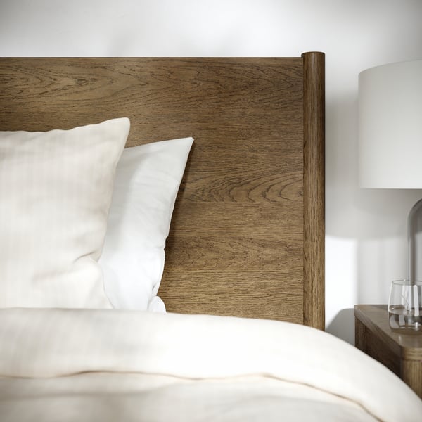 Well-crafted wooden bed with soft-close drawers, featuring a cosy, inviting design.