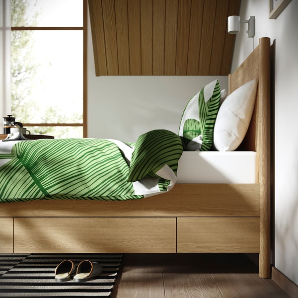Bed with soft-close drawers and slatted base, showcasing classic design and efficient space use.