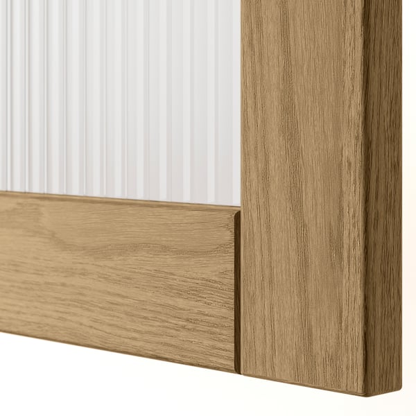 Close-up of TONSTAD wooden drawer corner, showcasing fine oak grain and smooth finish.