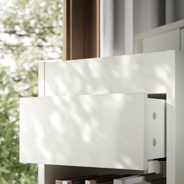 Modern white drawer unit with sleek, clean lines and smooth-closing drawers.