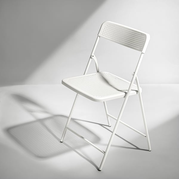 TORPARÖ: foldable white outdoor chair; powder-coated steel and plastic; perforated seat/back for ventilation; compact and sturdy