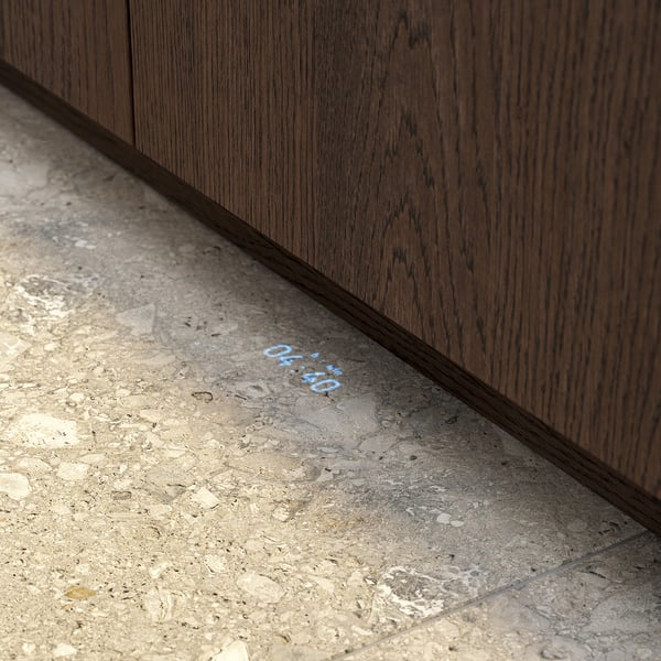 A time beam feature on a TORSBODA dishwasher floor, displaying remaining programme time in blue.