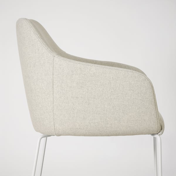 Modern chair with curved back, cushioned seat, and metal legs for comfort and support.