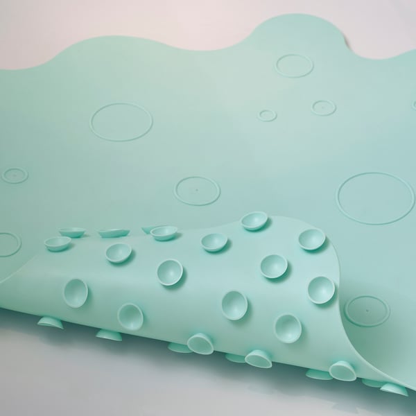 Mint green, non-slip bathtub mat with suction cups, designed for safety.