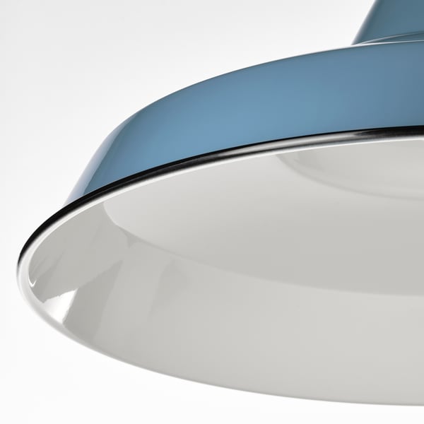Curved lamp with reflective finish.