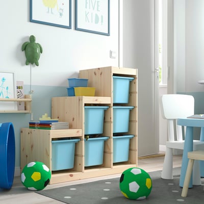 TROFAST storage with light wood, blue, yellow containers and kids toys.