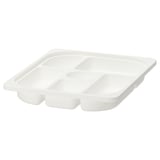 A white TROFAST storage tray with multiple compartments. Made of durable recycled plastic, it is designed for organising small items.