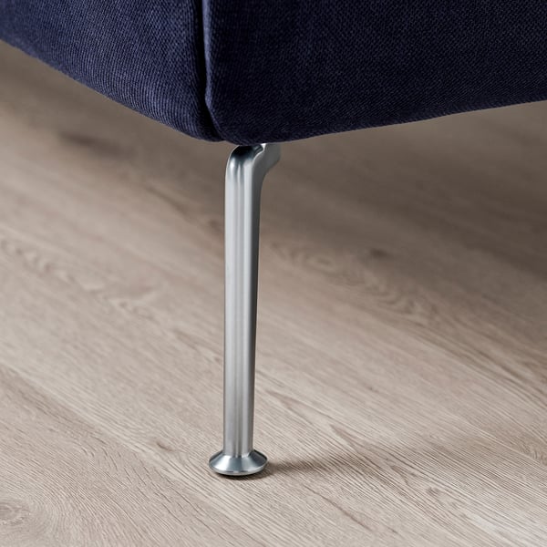 A modern bed with sleek, silver metal legs and curved headboard on a wooden floor.