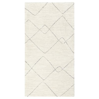 TVERSTED rug. Cream with diamond patterns, rectangular shape. Modern berber-inspired design, soft and stain-resistant.