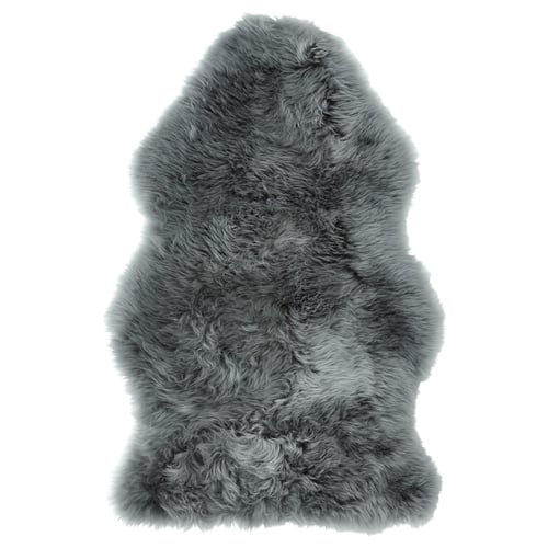 A grey ULLERSLEV sheepskin rug with soft, shaggy texture, rectangular shape, and natural variations.