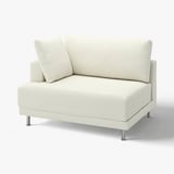 Modern white UPPÅKRA sectional sofa with soft bouclé fabric, raised legs, and clean lines.