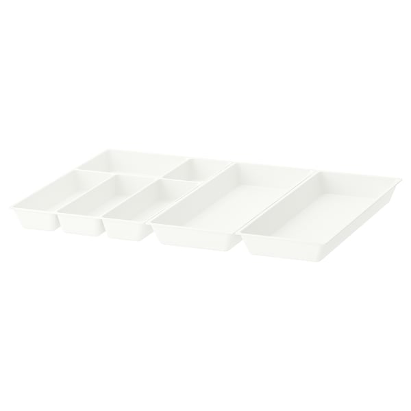 Three white plastic drawer organisers of different sizes, neatly arranged.