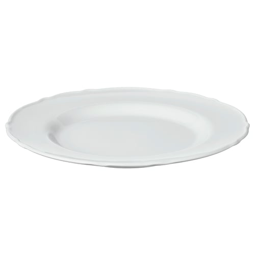 A white UPPLAGA side plate. It a soft, ruffled edge design and is made of durable porcelain.