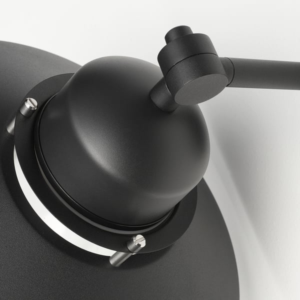 A sleek black outdoor wall lamp with a sturdy metal construction and clear glass shade, securely mounted on the wall.