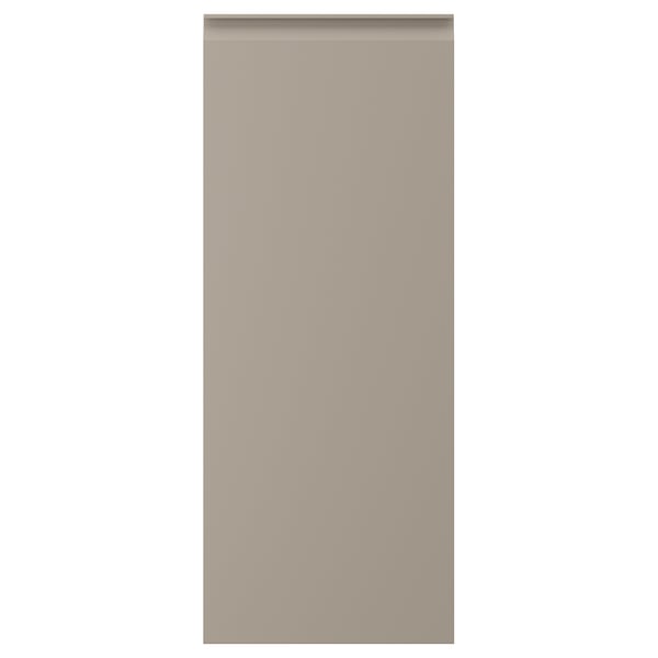 Beige kitchen cabinet door with recessed handles. Rectangular, flat, sleek design.