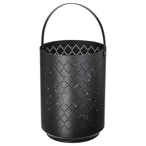 Black URSKILJA lantern, cylindrical, handle top, perforated star pattern. Steel base, polyester powder coated.