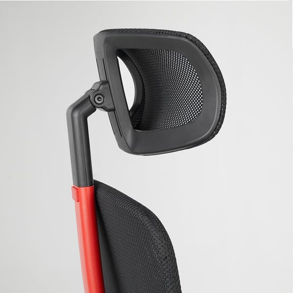 Ergonomic gaming chair backrest close-up, red armrest, mesh back.