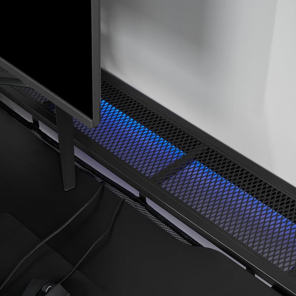 UTESPELARE desk with blue-lit mesh, showing cable management and adjustable legs.