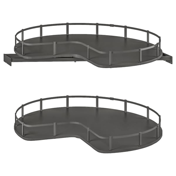 Two dark grey, corner cabinet carousels with circular trays and safety rails.
