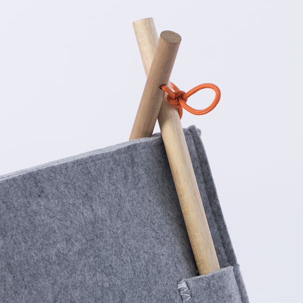 Sturdy grey cat house with wooden poles & orange rope.