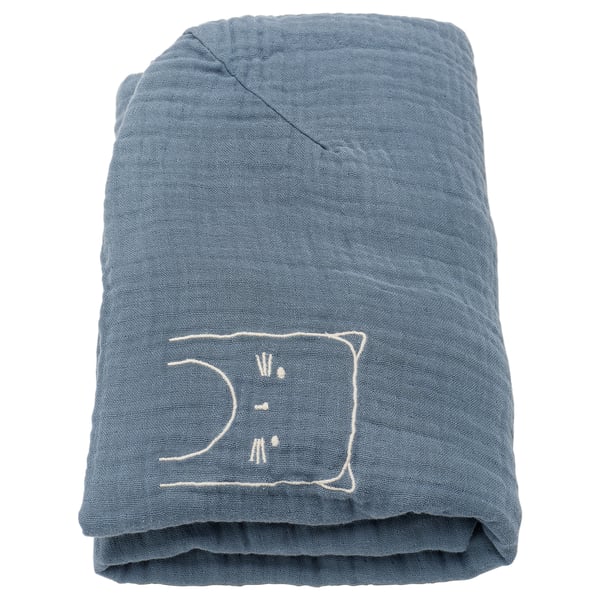 Folded blue organic cotton baby mat cover with white embroidered cat.