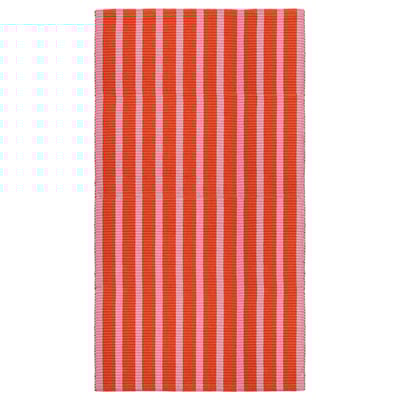 A rectangular rug named VÄGSKYLT with pink and orange vertical stripes, made of cotton.