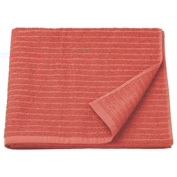 Bright orange VÅGSJÖN bath towel, rectangular, folded, with ribbed texture, made of 100% cotton.