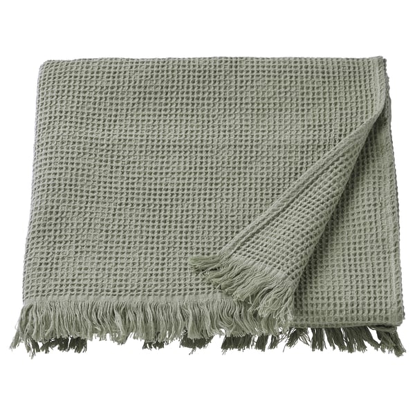 VALLASÅN green folded towel, cotton-viscose blend, textured pattern, fringed ends.