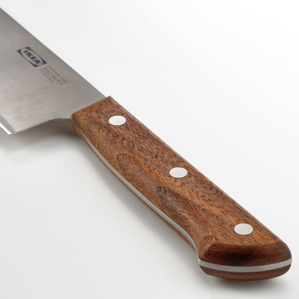 A high-quality kitchen knife with a stainless steel blade and dark walnut handle, showcasing excellent craftsmanship and durability.