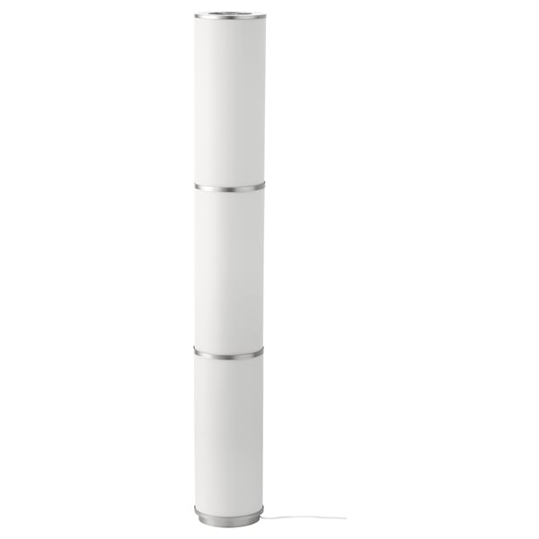 A VIDJA floor lamp. Its white, cylindrical, and made of polyester and plastic. It stands upright with a soft, warm light.