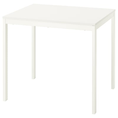 White IKEA VIHALS extendable dining table with metal legs.
