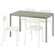 A VIHALS green dining table with four white chairs. Minimalist design, made of metal and plastic.