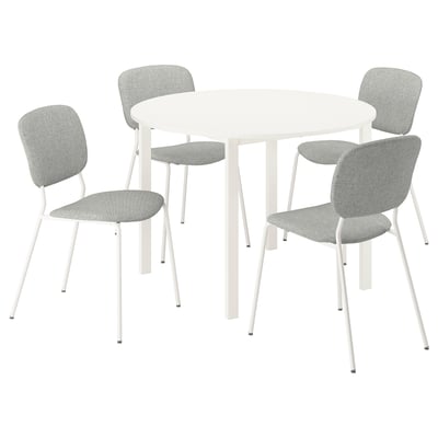 A white VIHALS round dining table with four light grey cushioned chairs arranged around it, ideal for socialising.
