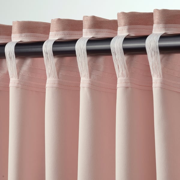 Soft pink curtains with linear texture, rod-pocket header, room-darkening fabric.