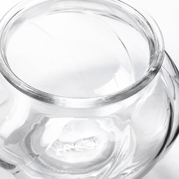 Clear, elegant glass vase shown, highlighting its smooth, reflective surface and simple design.