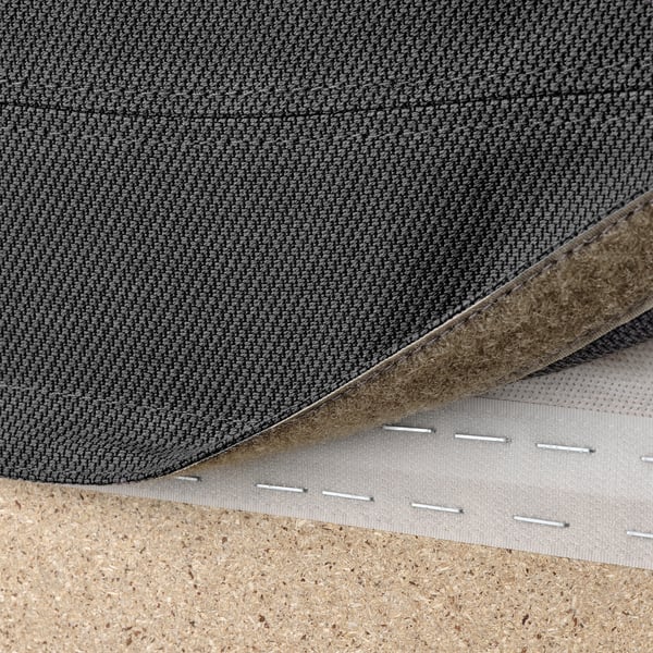 Close-up of a machine-washable, detachable sofa cover with hook-and-loop fastener, ensuring easy cleaning and customization.