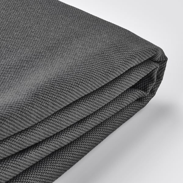 Folded grey sofa bed cover, showcasing texture and two-tone effect, highlighting quality and comfort.