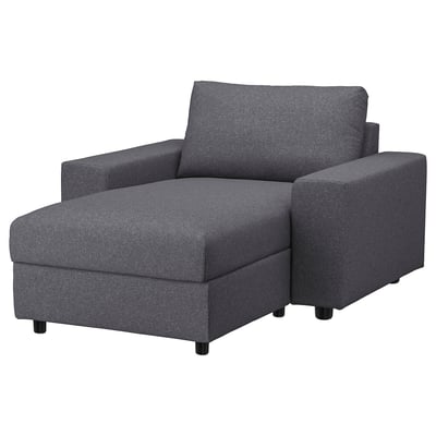 Grey VIMLE chair with ottoman, modern design, soft wool-like feel.