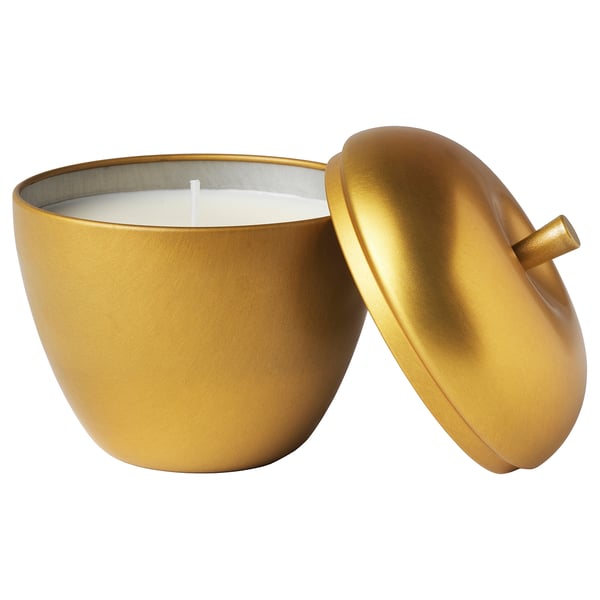 Gold-colored apple-shaped container candle with lid; made of tinplated steel, offering warm lighting and sweet scent.
