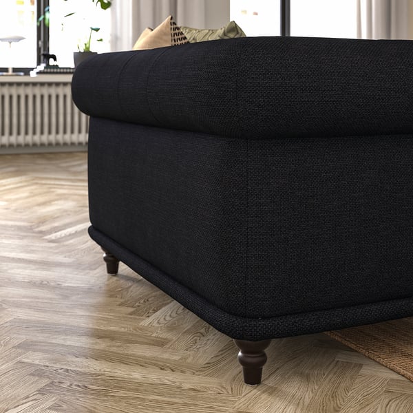 Black VISKAFORS sofa, dark fabric, rolled arms, wooden legs, modern classic design.