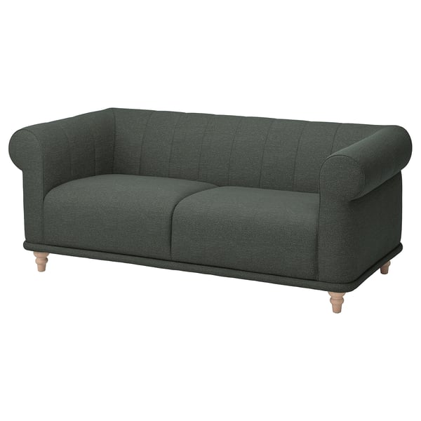 Dark green fabric sofa with rolled arms, soft cushions, and wooden legs. Classic, inviting design.