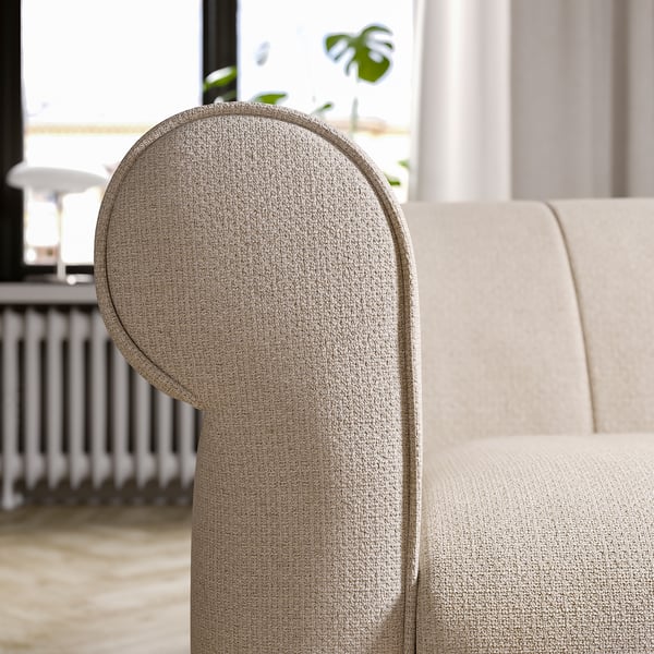 Modern VISKAFORS sofa, light beige, soft rounded arms, inviting deep seat, eco-friendly fabric.