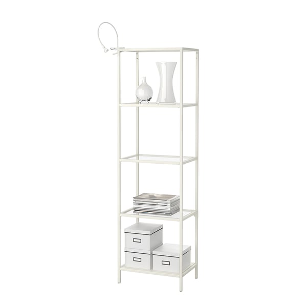 White metal shelf unit with four glass shelves. Holds books, boxes, and vases. Includes adjustable feet and wall fastener.