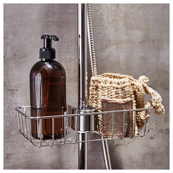 Accessible chrome shower basket: holds liquid soap pump and soap pouch, mounted on metal rail.