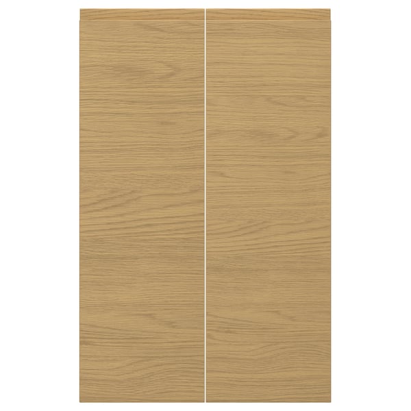 VOXTORP oak finish door panels, sleek with integrated handles, warm modern style.