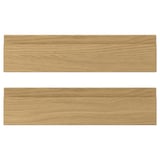 Two VOXTORP drawer fronts with an oak finish, featuring sleek, integrated handles.