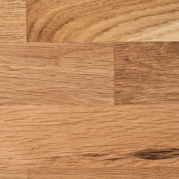 Smooth, light oak wood surface with visible grain pattern, showcasing quality craftsmanship.