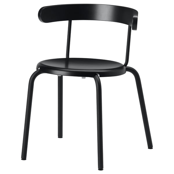 A black YNGVAR chair with a curved back, beech veneer seat, and metal legs. The design is minimalist and modern.