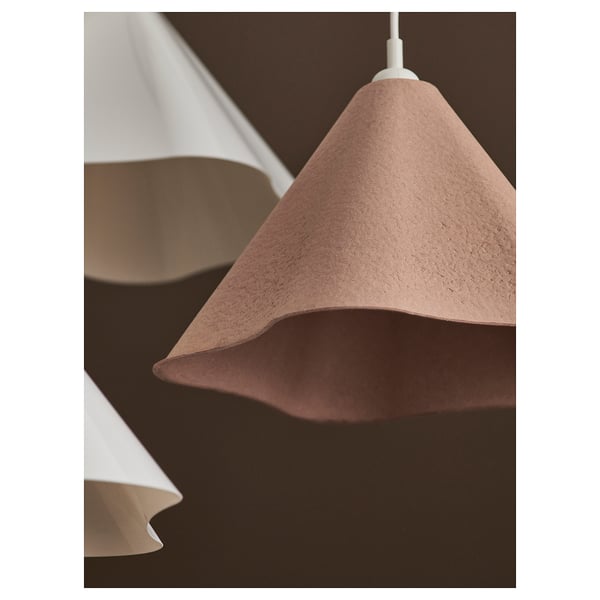 Three hanging lamps with distinct, asymmetrical paper shades in brown and white tones.