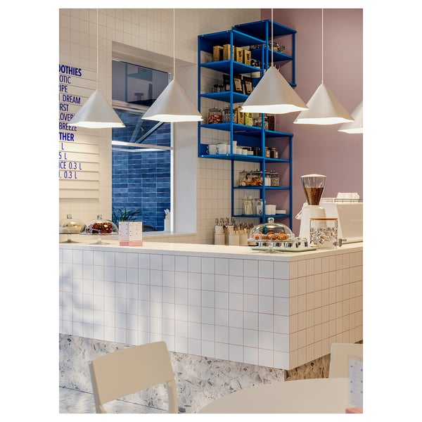Modern café with ZEBRASÄV lights, blue shelves, and pastries.